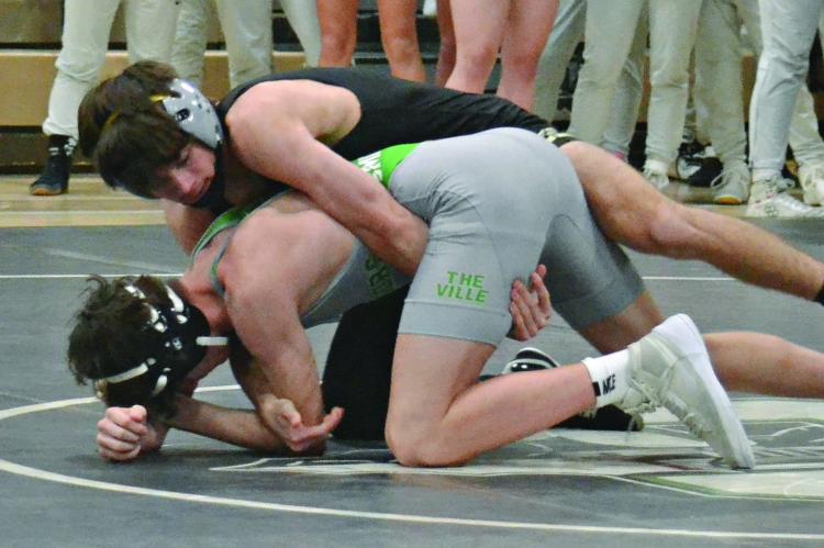 RYNE MARCUM, an Excelsior Springs junior, gains control during his match with Smithville’s Ben Woody Jan. 3 at Smithville in a Greater Kansas City Suburban Conference-Blue Division dual. DUSTIN DANNER | Staff