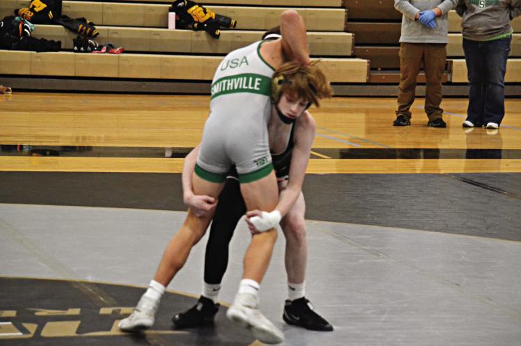 COOPER COLLINS, a first-year high schooler at Excelsior Springs, gains control and then lifts his opponent for a takedown during the Tigers’ Jan. 4 home dual with Smithville. DUSTIN DANNER | Staff
