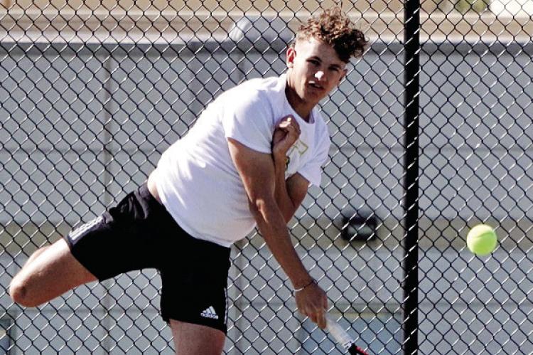 NO. 1 SINGLES player Carter Pitts serves an ace for Excelsior Springs on Senior Night May 1 against Ruskin. DUSTIN DANNER | Staff