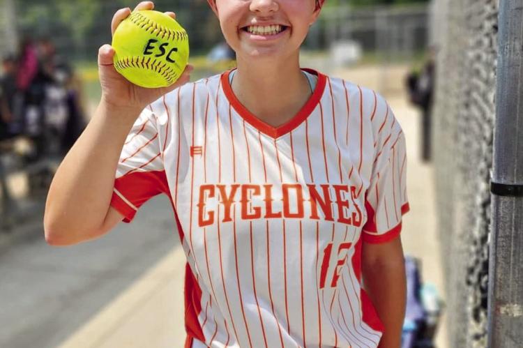WILLA SCHREIER displays a home run ball after swatting a four-bagger during Heartland World Series competition this summer. DUSTIN DANNER | Staff