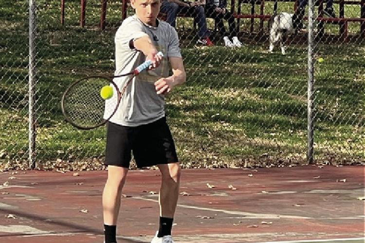 SOPHOMORE AUSTIN COLLINS executes a forehand down the line for Excelsior Springs on March 27 at Higginsville against Lafayette County.