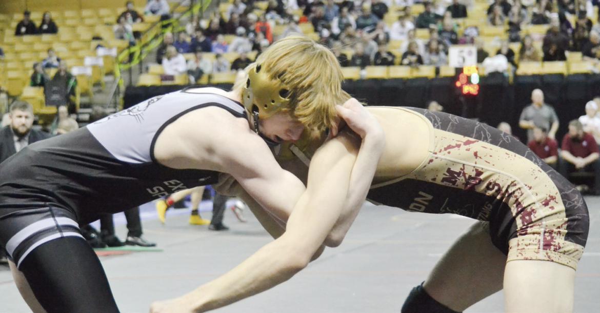 COOPER COLLINS, left, ties up with Eldon’s Jesiah Simmons in the Class 1 113-pound state title match Feb. 23 at Mizzou Arena. DUSTIN DANNER | Staff