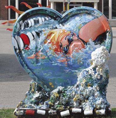 THE KANSAS CITY Parade of Hearts is making an appearance in Excelsior Springs. Gwynevere Buie’s artwork, ‘Splash!’, is a tribute to the Kansas City Blazers swim team and can be found in the downtown area. SHAWN RONEY | Staff