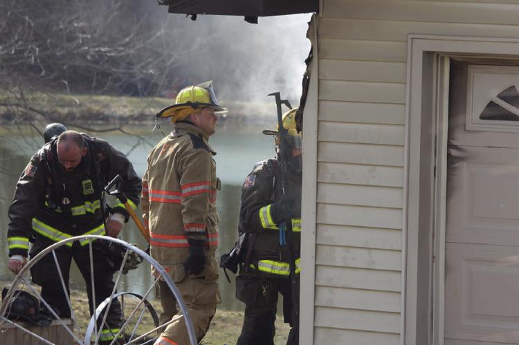 ESFD AND LFD work together to extinguish the flames on a detached garage. MIRANDA JAMISON | Staff