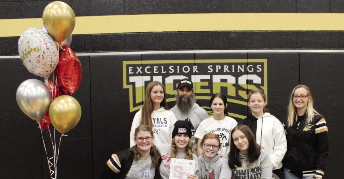 PICTURED FOR Vada Burton’s signing ceremony are, front row, Adrian Crawley, Burton, Paige Barber, Bailee Baxter; back row, Gabby Scrivener, coach Scott Schwab, Justus Sutton, Lilly Wilson, Alyssa Betts. Submitted
