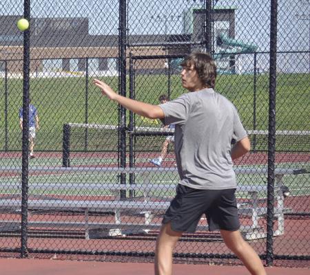 EXCELSIOR SPRINGS junior Owen Peterson keeps his eye on the ball as he hits a forehand shot during a recent home match. DUSTIN DANNER | Staff